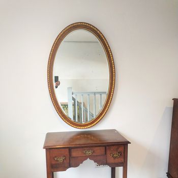 Antique parcel gilt and oak  oval mirror