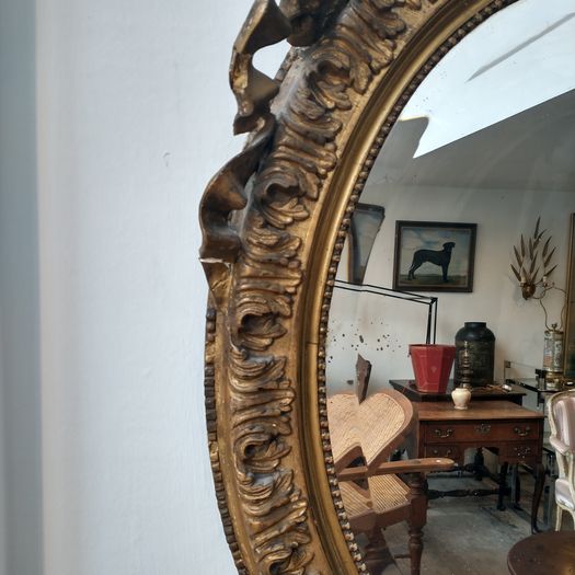 Antique early C19th oval mirror