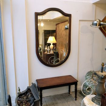 Very large antique shield mirror