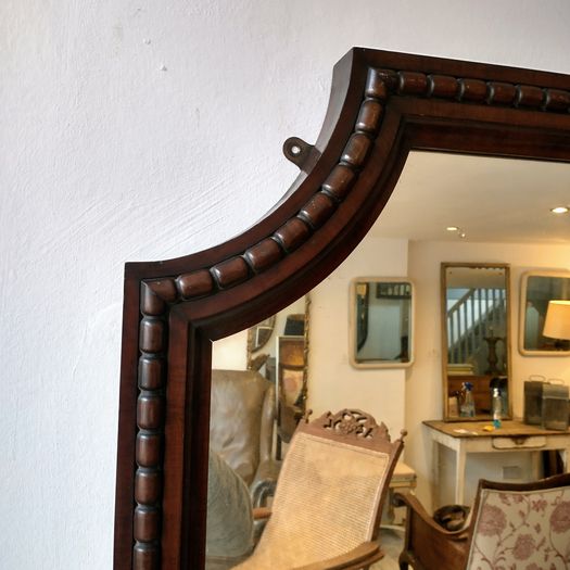 An unusual large antique mirror