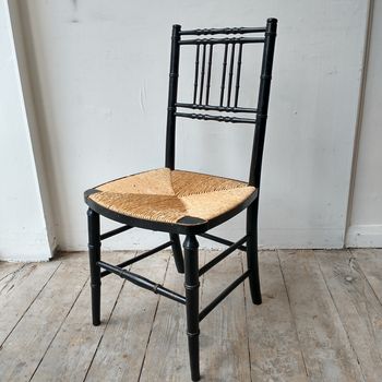 Regency ebonised rushed chair