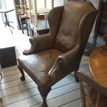 Antique leather wing back armchair