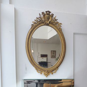 Antique oval crested mirror