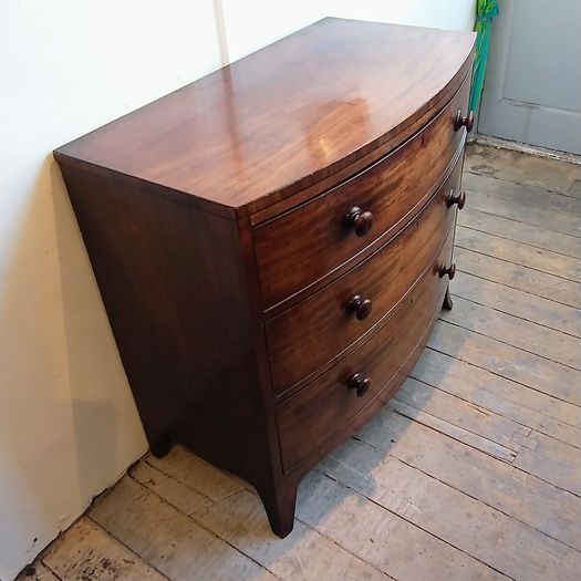 Early Regency bow fronted chest of drawers