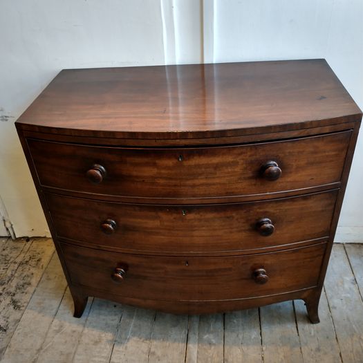 Early Regency bow fronted chest of drawers