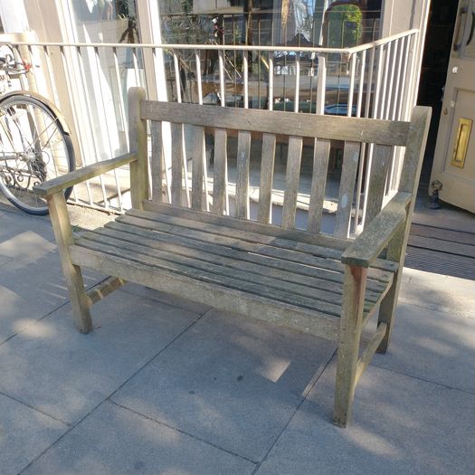 Old weathered teak garden bench