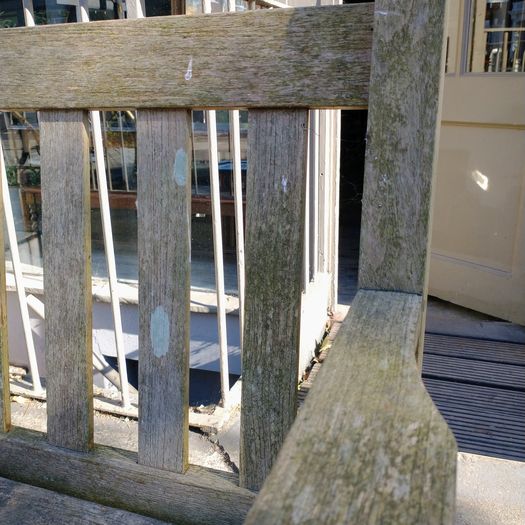 Old weathered teak garden bench