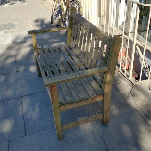 Old weathered teak garden bench