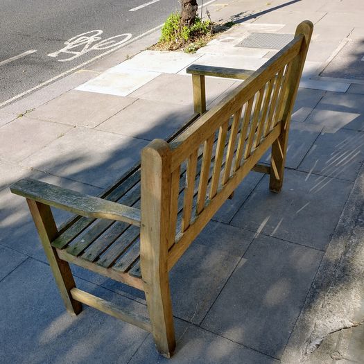 Old weathered teak garden bench