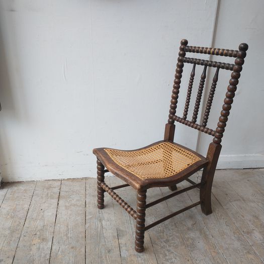 Antique bobbin slipper chair