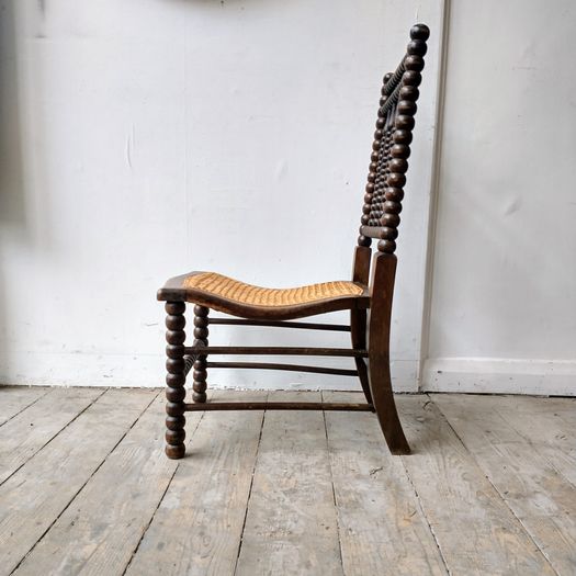 Antique bobbin slipper chair