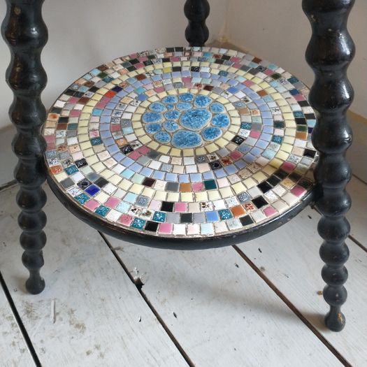 Antique bobbin table with tile decoration