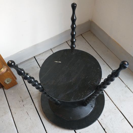 Antique bobbin table with tile decoration