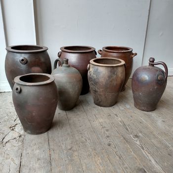 Collection of 7 dark brown stone ware vessels