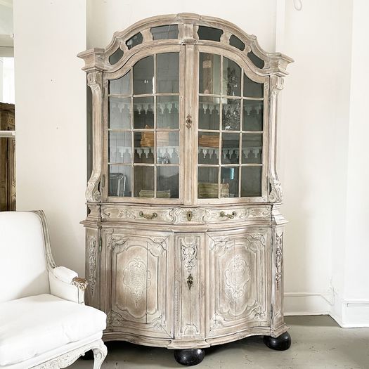 An 18th Century Limed Oak Serpentine Fronted Bruges Vitrine with Pale Blue Interior