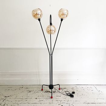 A Mid Century French Three Arm Black Metal Floor Light with Atomic Base
