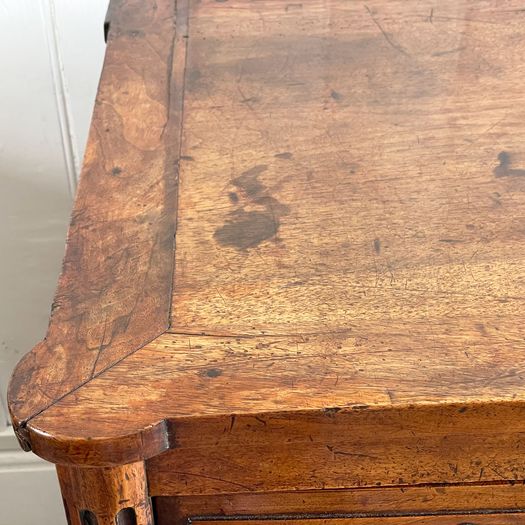 A Louis XVI Walnut Commode with Original Brass Handles