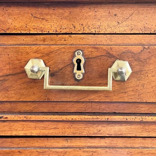 A Louis XVI Walnut Commode with Original Brass Handles