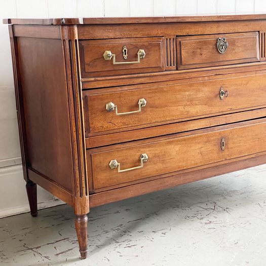 A Louis XVI Walnut Commode with Original Brass Handles