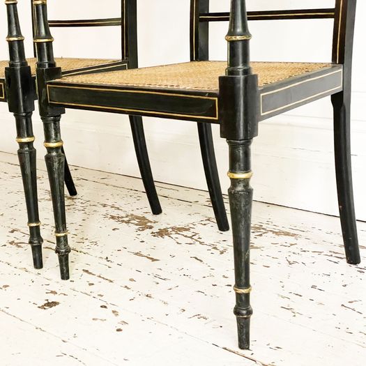A Set of 8 Regency Style Late 19th C Ebonised Caned Armchairs