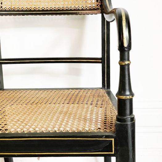 A Set of 8 Regency Style Late 19th C Ebonised Caned Armchairs