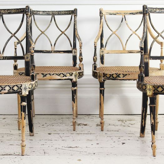 Two Pairs of Black Hepplewhite Caned Armchairs