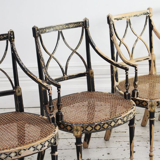 Two Pairs of Black Hepplewhite Caned Armchairs