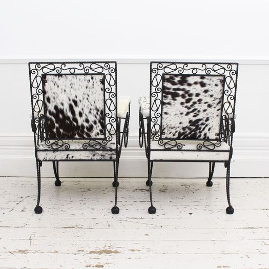 A Pair of 1950's French Cowhide Wrought Iron Armchairs