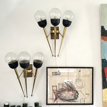 A Large Pair of Mid Century Brass Torch Wall Lights