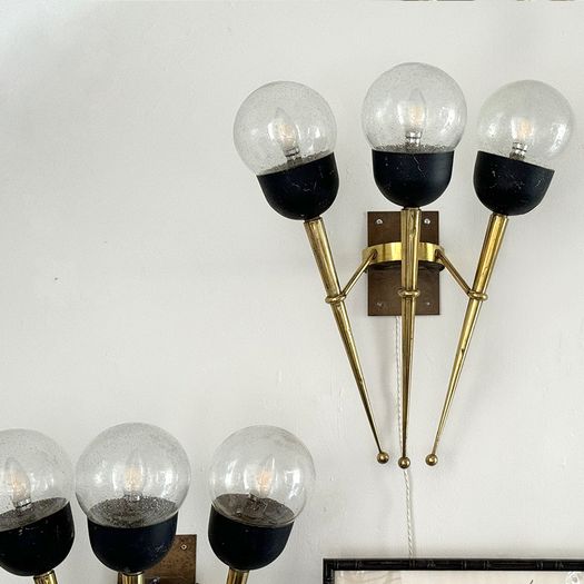 A Large Pair of Mid Century Brass Torch Wall Lights