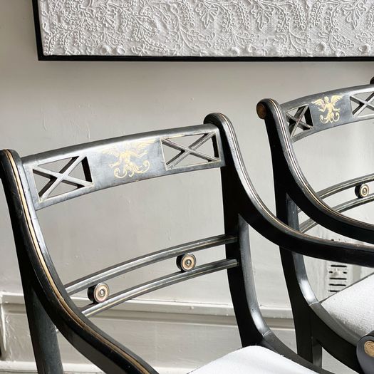 A Pair of Regency Style Ebonised and Decorated Armchairs