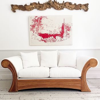 A Superb Pair of Scroll Arm Rattan Upholstered Sofas