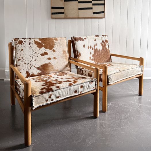 A Pair of 1970's Italian Lounge Armchairs with Cowhide Upholstery