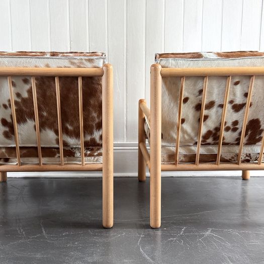 A Pair of 1970's Italian Lounge Armchairs with Cowhide Upholstery