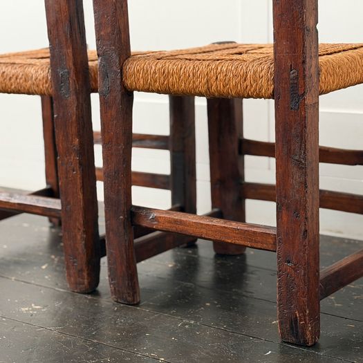 A Set of Six Antique Carved Folk Art Pyrenean Chairs with Woven Seats