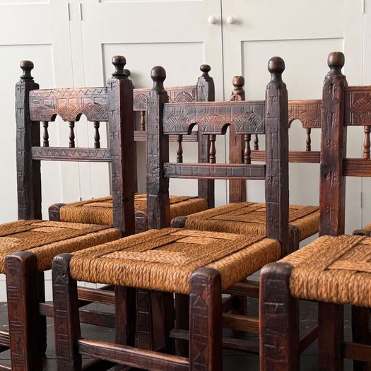A Set of Six Antique Carved Folk Art Pyrenean Chairs with Woven Seats
