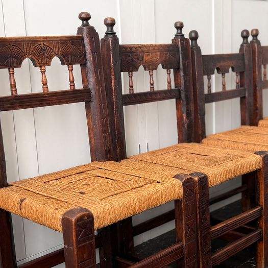 A Set of Six Antique Carved Folk Art Pyrenean Chairs with Woven Seats