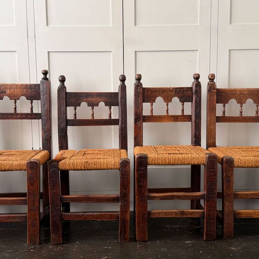 A Set of Six Antique Carved Folk Art Pyrenean Chairs with Woven Seats