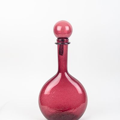 A vintage hand-blown glass chestnut bottle in amethyst by La Verrerie de Biot