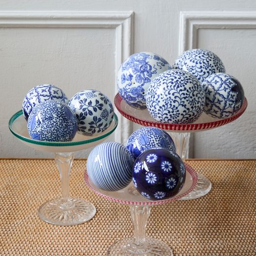 A collection of ten vintage Bombay Company blue & white ceramic carpet balls