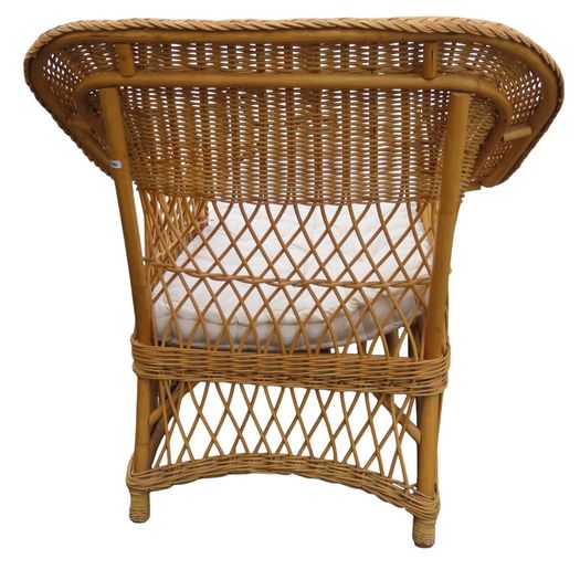 A vintage wicker day bed or chaise longue,with cream upholstered mattress and cushions