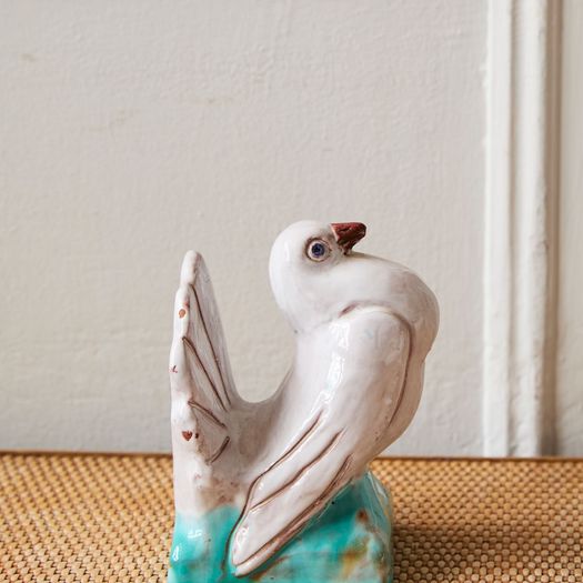 A French glazed pottery figure of a dove