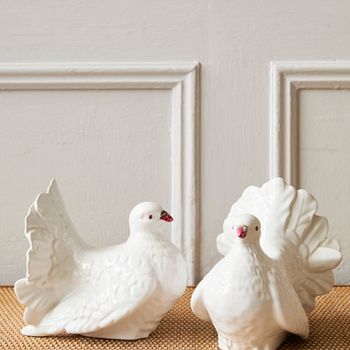 A pair of vintage ceramic dove figurines