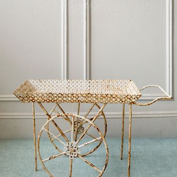 A vintage French pierced metal drinks trolley/bar