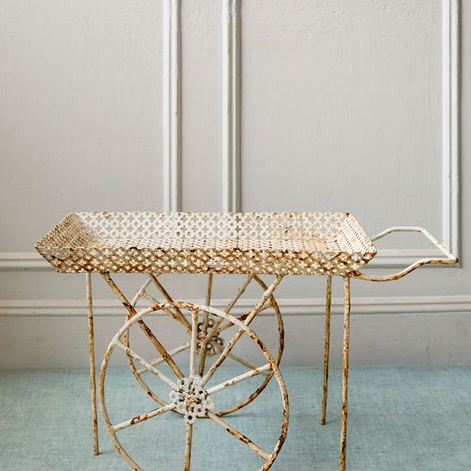 A vintage French pierced metal drinks trolley/bar