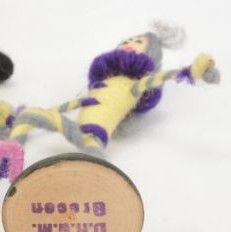 A rare Grecon miniature dancing doll on a black painted wooden base made in Germany in the 1920s