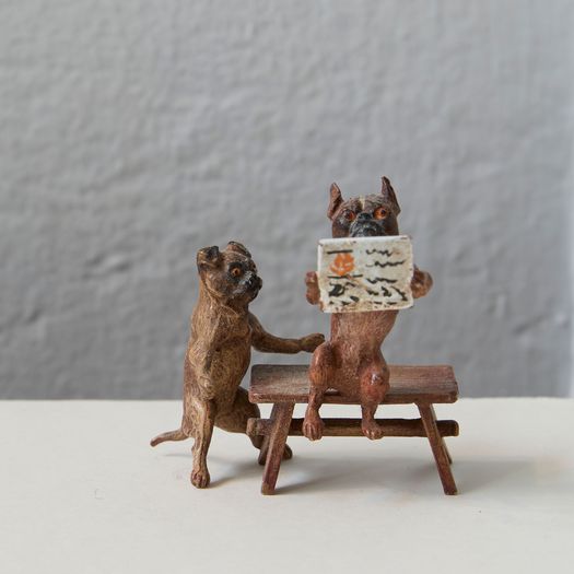 A set of three cold painted metal cast models of pugs, mouse and cats