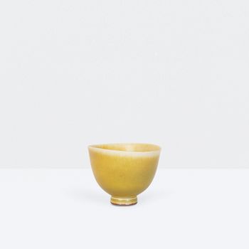 Miniature yellow bowl on foot thrown by Berndt Friberg