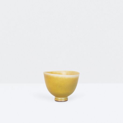Miniature yellow bowl on foot thrown by Berndt Friberg