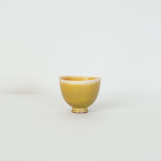 Miniature yellow bowl on foot thrown by Berndt Friberg